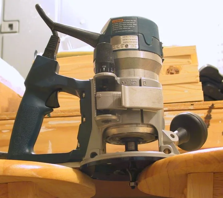 Category example: a handheld woodworking router with its cutting bit visible.