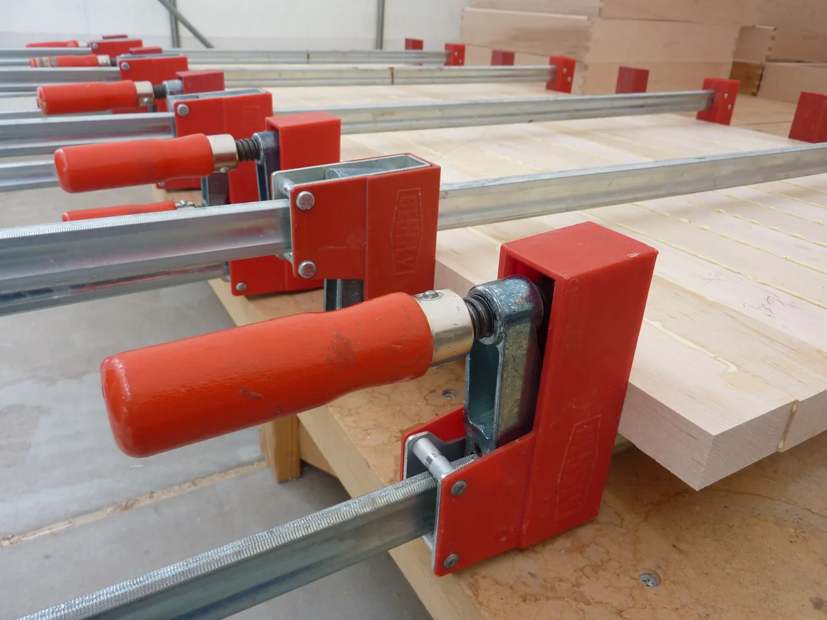 Category example: bar clamps holding a maple tabletop during glue-up.